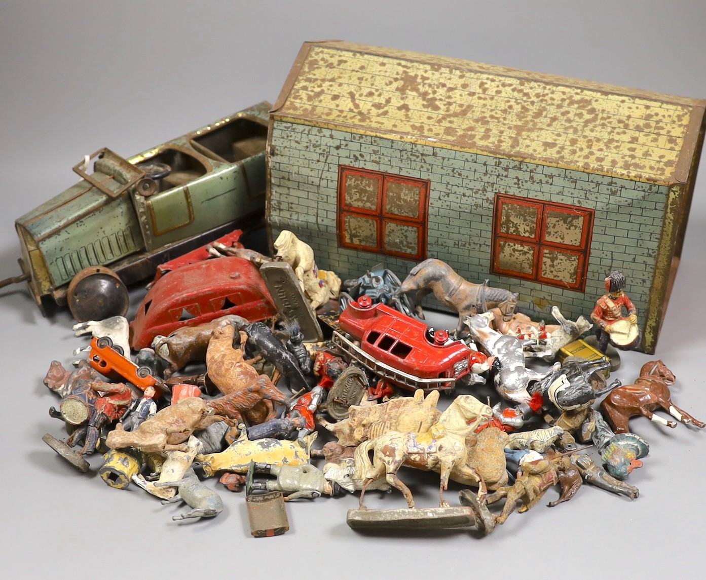 Brenco lithographed tinplate open tourer, and garage, and assorted hollow-cast toys, Elastolic, Dinky Toys, etc.